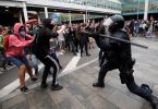 Flights canceled as Barcelona Airport becomes battlefield between protesters and police