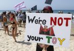 Israelis stage festive beach party protests against new COVID-19 lockdown
