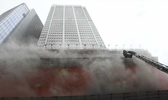More than 300 people trapped on roof of burning skyscraper in Hong Kong