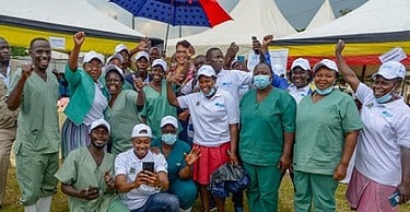 US Ambassador photo moment with health workers image courtesy of US Embassy | eTurboNews | eTN